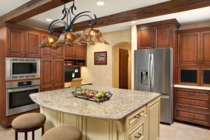 An old world, Mediterranean-inspired kitchen in Palo Alto features an ornate light fixture.