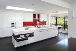 An über-modern Los Altos Hills kitchen is sleek, with a bold pop of color on the backsplash.