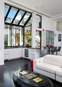 A modern, light-filled bar adjacent to living space