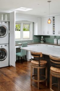 Stacked laundry and desk nook in kitchen