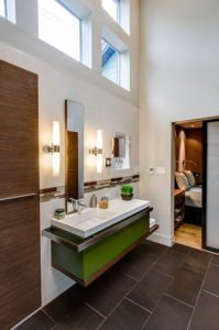 A modern bathroom in downtown Palo Alto adds a pop of color in its floating vanity.