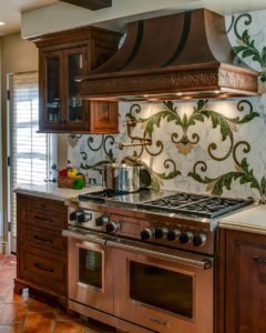 An ornate backsplash adds warmth to this Mediterranean-inspired kitchen in Palo Alto.