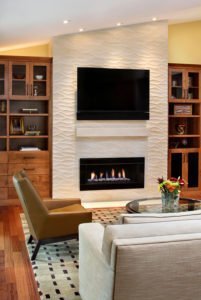 A textured fireplace offers an organic feel in this Palo Alto living room.