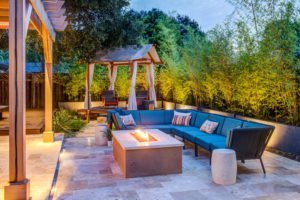 An outdoor Design + Build project featuring a fire pit and trellis.