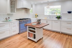 A Menlo Park kitchen adds a pop of color with a beautiful blue stove.