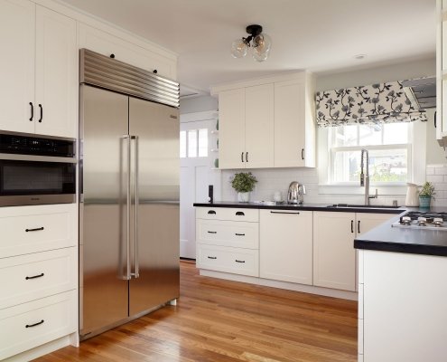 This charming kitchen in Santa Clara takes full advantage of vertical space to maximize storage.