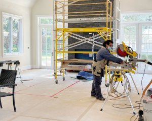 Workers remodeling inside of a house
