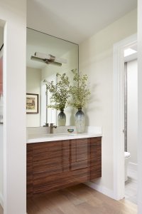 A modern bathroom in Los Altos showcases a sleek wooden vanity.