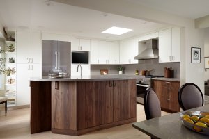 An island provides separation between the kitchen and dining room in this modern Los Altos home.