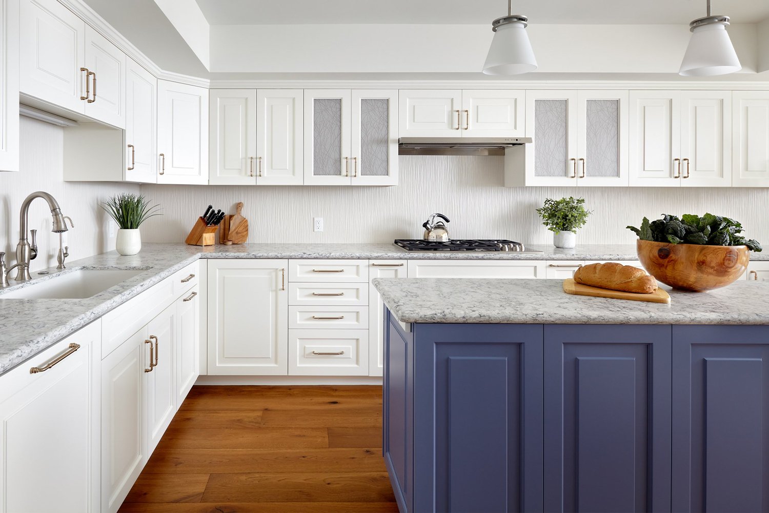 An airy, bright kosher kitchen in Los Gatos A Los Gatos kitchen features bright white cabinetry and a blue island with some artful finishes.